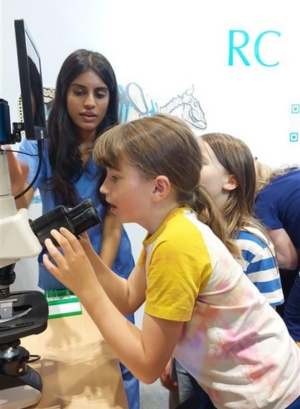 New Scientist Live - girl with microscope