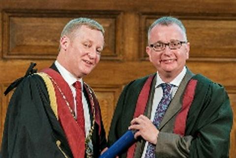 Stuart Reid (left) awards a Fellowship to Professor Kenneth Smith 