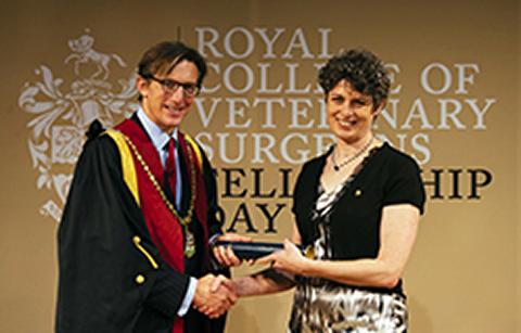 Dr Clare Rusbridge receiving her certificate of Fellowship from RCVS President Chris Tufnell 