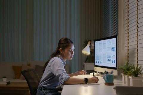 woman sitting at desk working