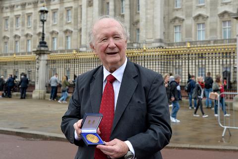 Des Thompson in October 2014 outside Buckingham Palace having received his Queen's Medal